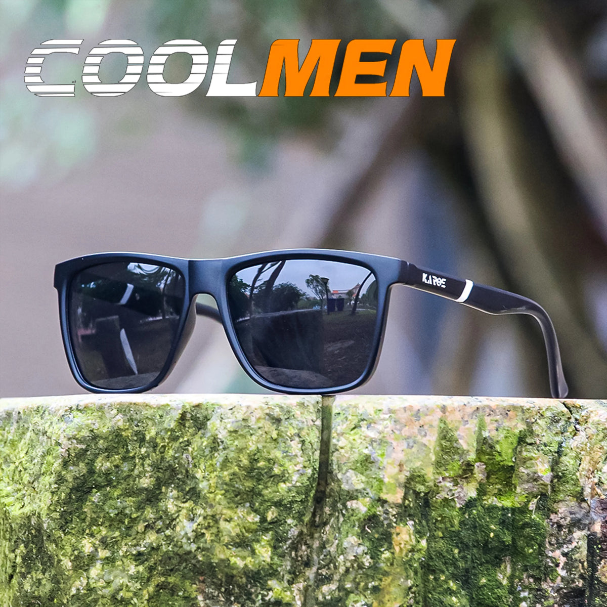 A pair of black polarized sports sunglasses resting on a mossy tree branch in an outdoor setting.