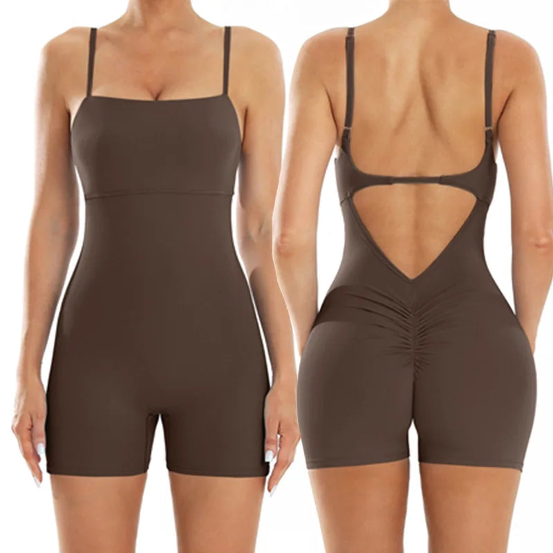 A woman models a brown, backless fitness jumpsuit from the rear view.