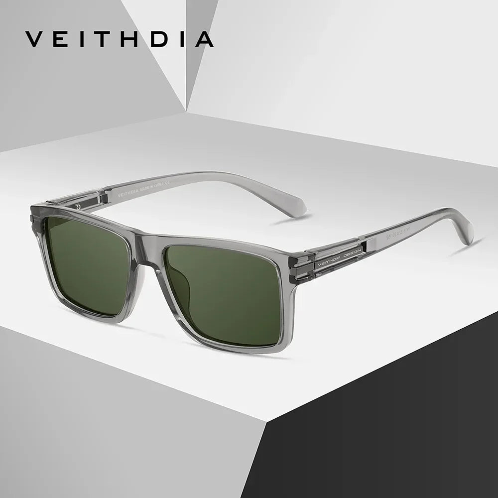 A pair of silver-framed, square polarized sunglasses resting on a white surface.