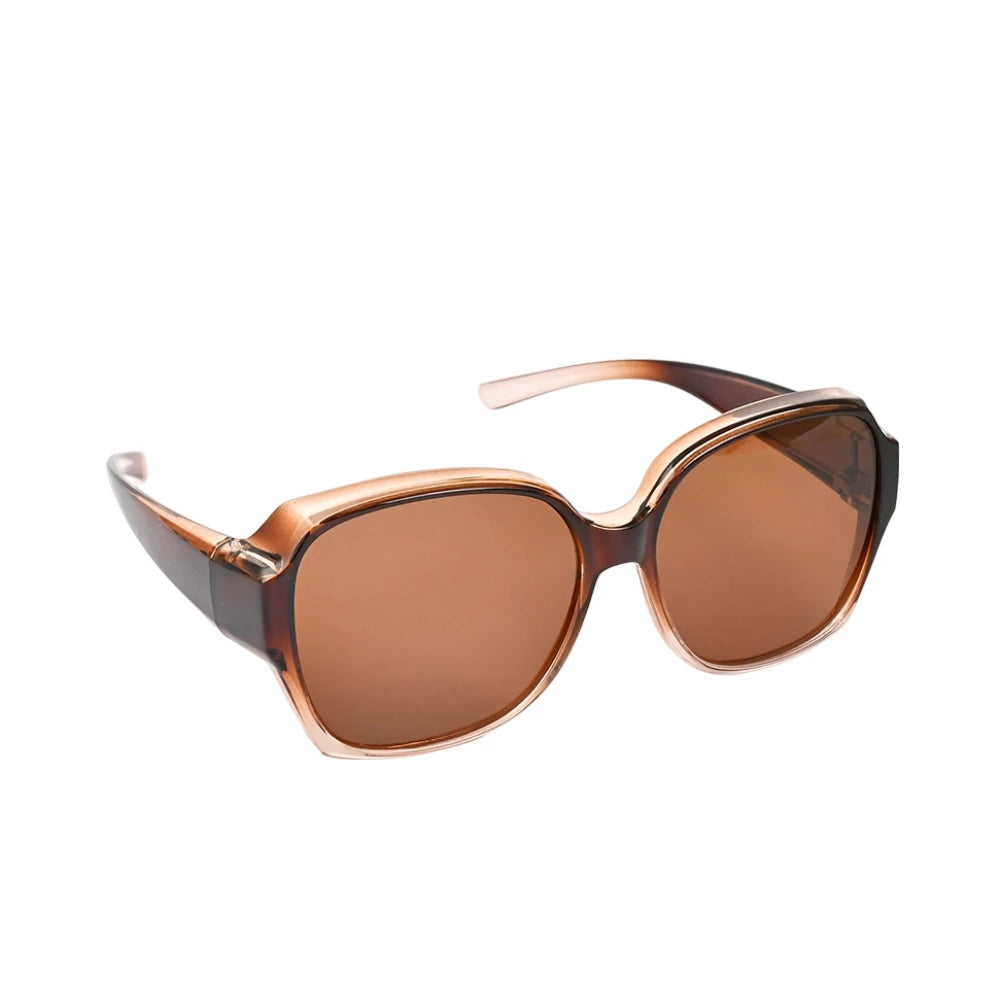 Brown-tinted, oversized sunglasses with a tortoiseshell frame and temple