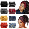 A collection of black, red, and blue cross-knotted fabric headbands for yoga and workout.