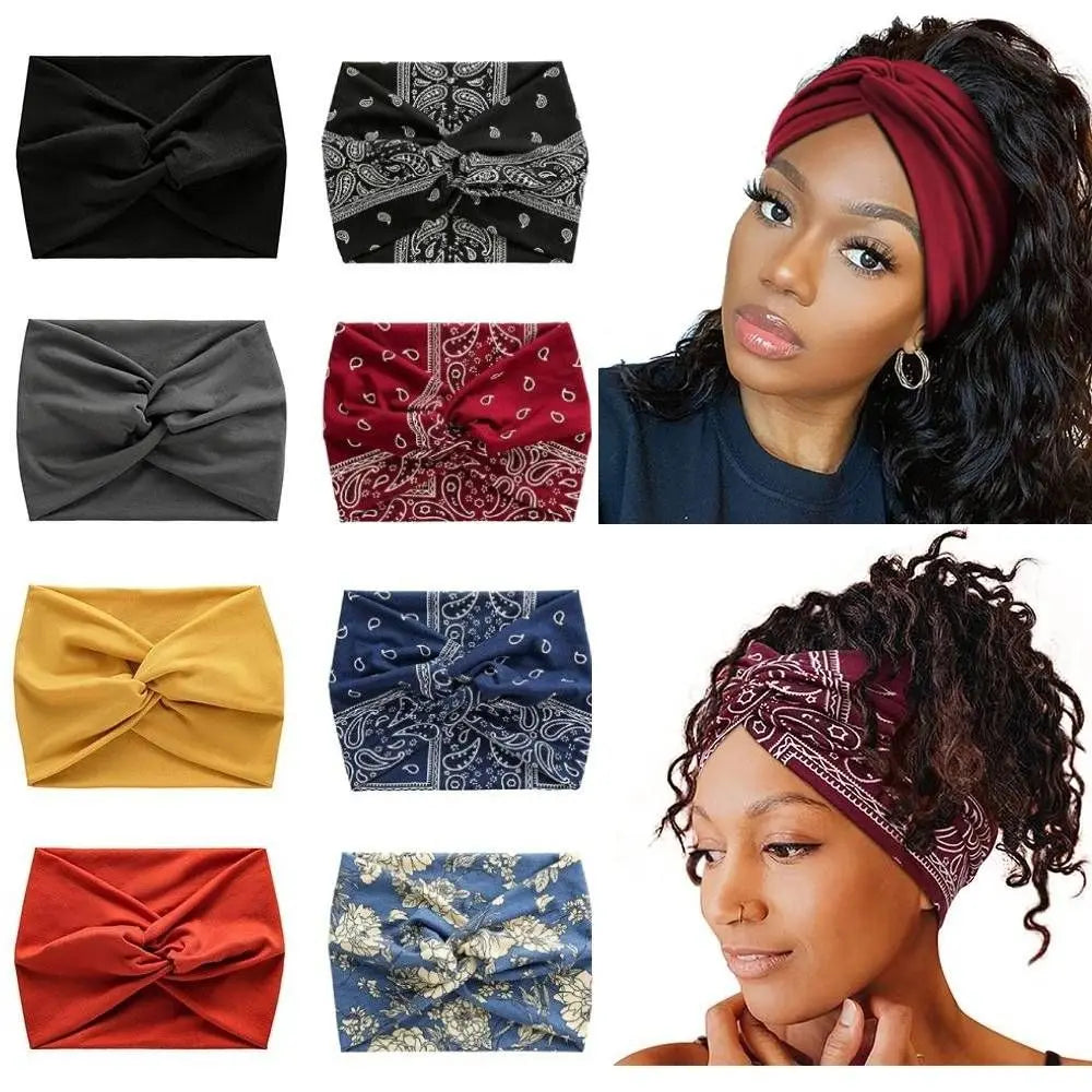A collection of black, red, and blue cross-knotted fabric headbands for yoga and workout.