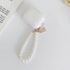 A white leopard pearl protective case for AirPods Pro is displayed on a white surface.