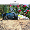 A pair of black mirrored silver lens sunglasses resting on a rough, light-colored rock outdoors.