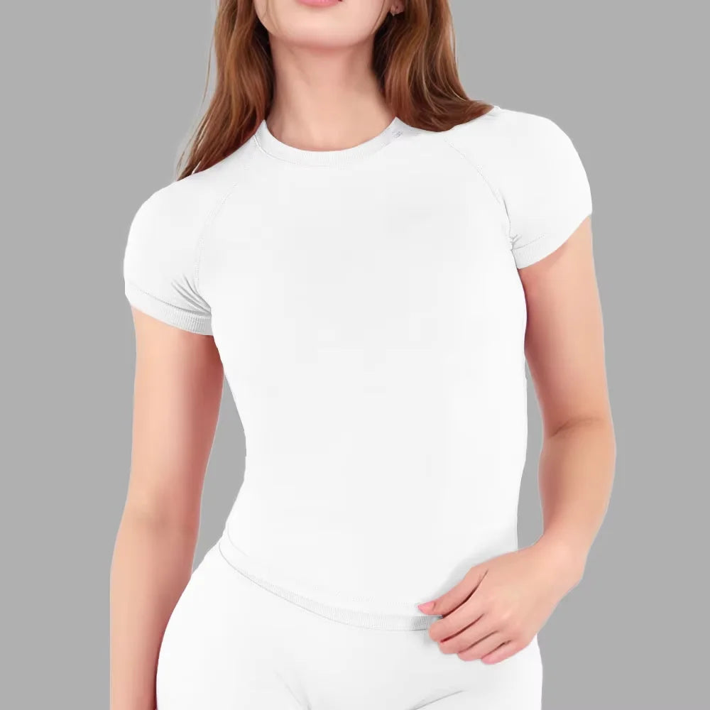 A white performance fitness short sleeve top for women shown on a model.