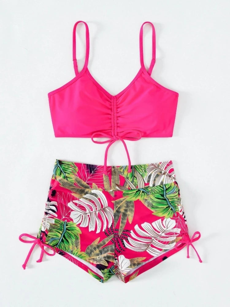 A bright pink floral print two-piece high-waist bikini set featuring tropical leaves.