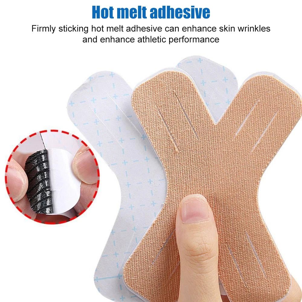 A hand is applying a piece of tan kinesiology tape to the skin, demonstrating its use for enhancing skin wrinkles and athleti