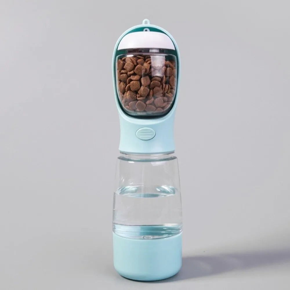 A light blue portable pet water and food dispenser with a clear top for food and a water reservoir.