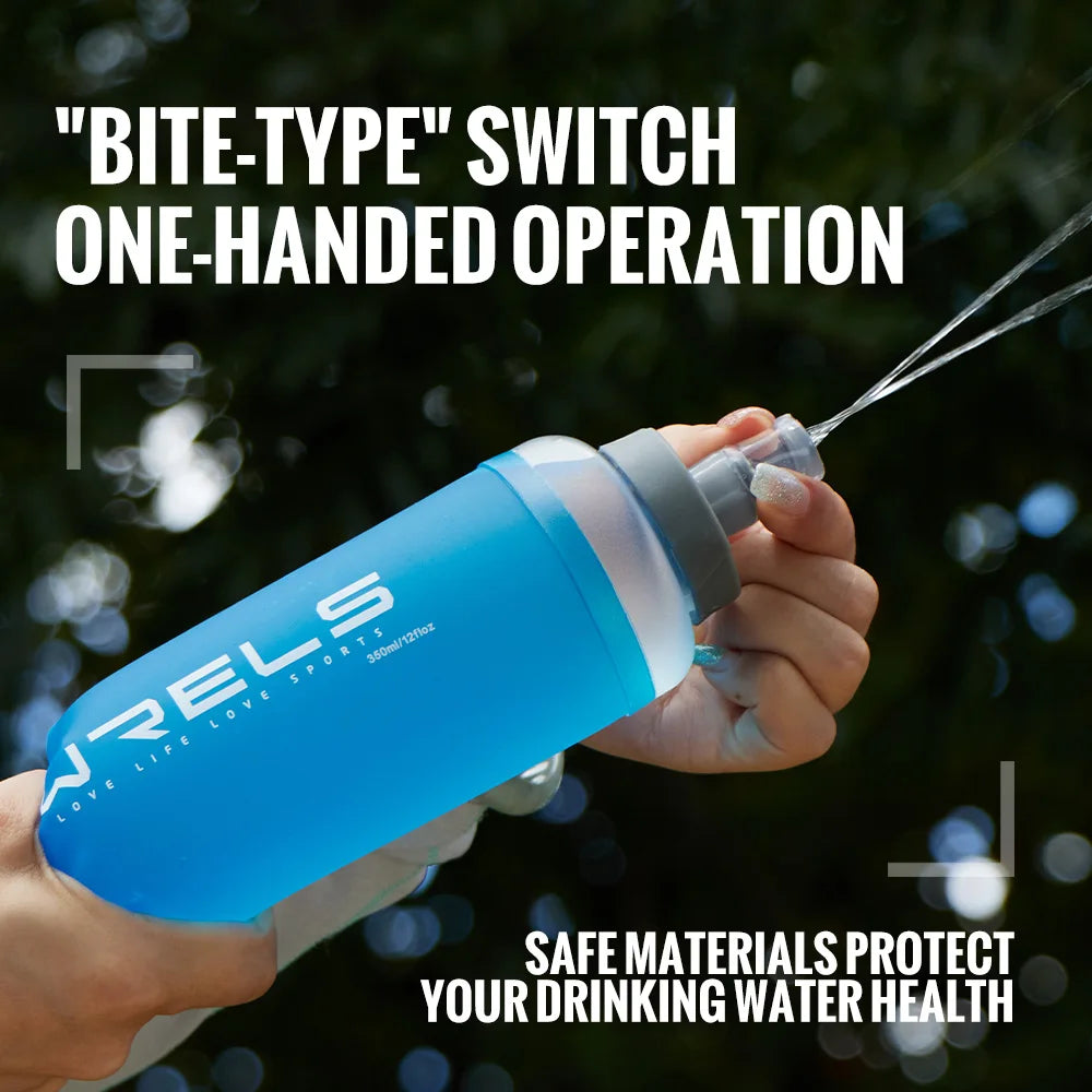 A hand holds a blue water bottle with a switch mechanism, demonstrating one-handed operation for drinking water.