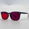 A pair of black sunglasses with vibrant red and purple mirrored lenses resting on a white surface.
