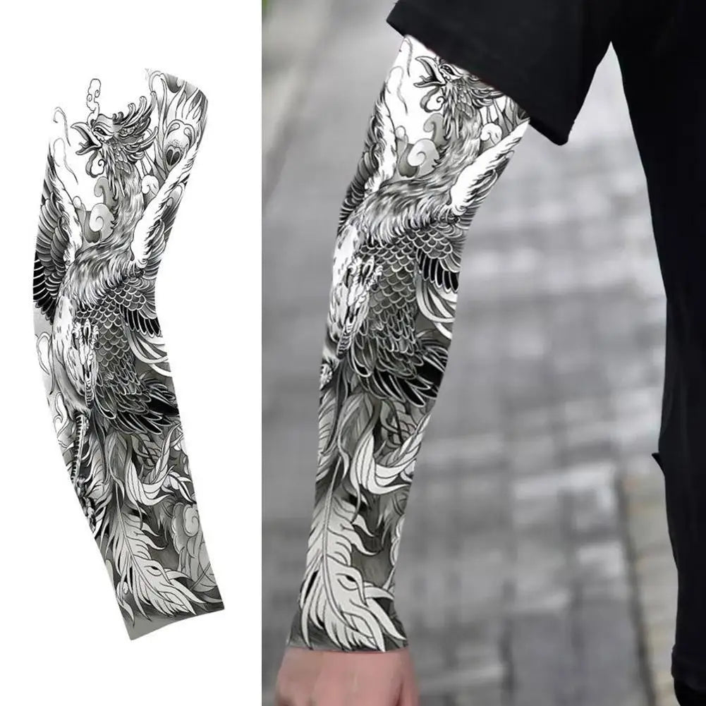 Black and white detailed dragon tattoo style arm sleeve on a person's arm.