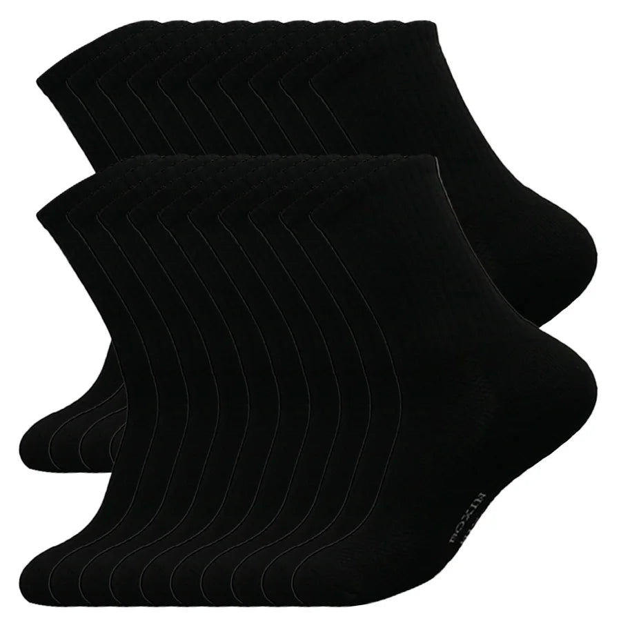 A stack of black men's essential warm socks for outdoor activities.