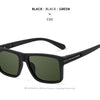 Black sunglasses shown in a studio setting with black frames and dark green lenses.