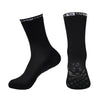 A pair of black performance sports gripping socks shown from the side.
