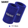 A pair of royal blue athletic wristbands with the AOLIKES logo visible on the cuff.