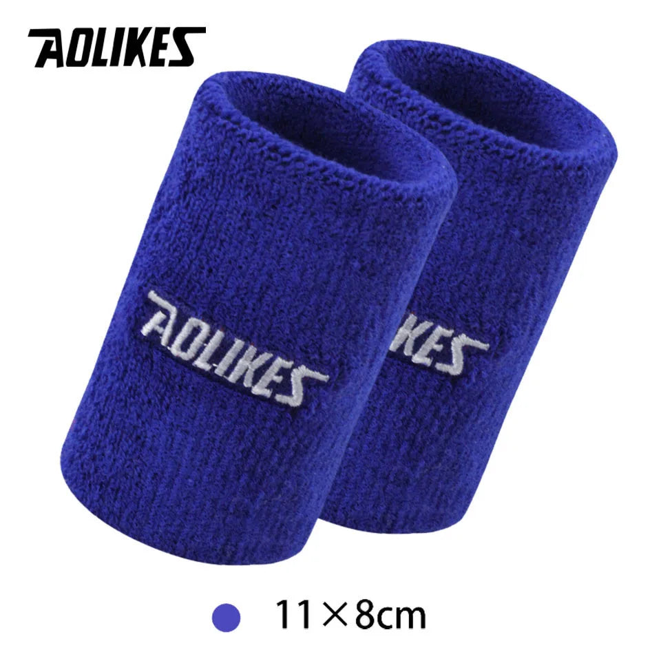 A pair of royal blue athletic wristbands with the AOLIKES logo visible on the cuff.