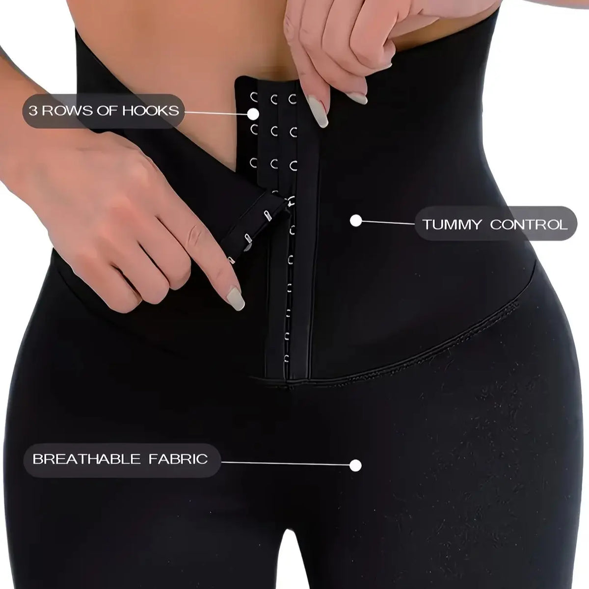 Close-up of a black high waisted shaping legging showing hook closures and breathable fabric.