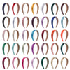 A collection of solid satin hair bands in various colors and finishes.