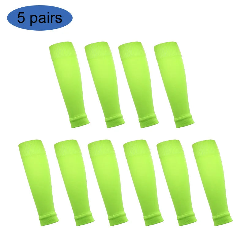 Five pairs of neon yellow football shin guards for leg protection