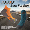 A collection of colorful performance ankle socks for running and fitness displayed against a road background.