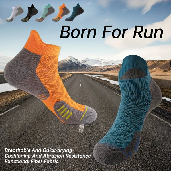 A collection of colorful performance ankle socks for running and fitness displayed against a road background.