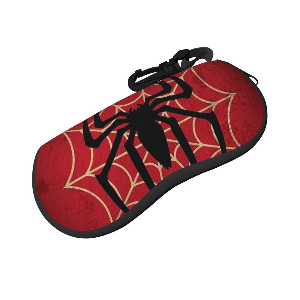 A red pouch featuring a black spider web design, intended for holding eyeglasses.