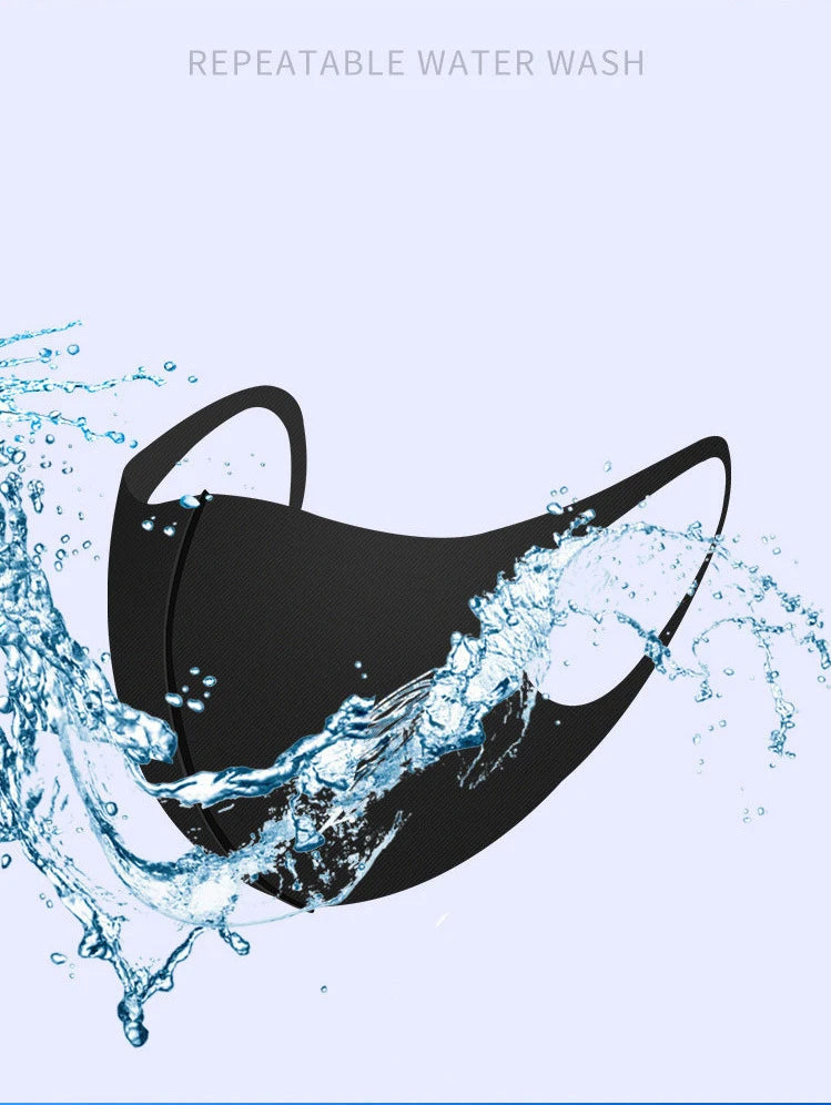 A black UV protection face mask is being washed with water, showing a repeatable water wash process.