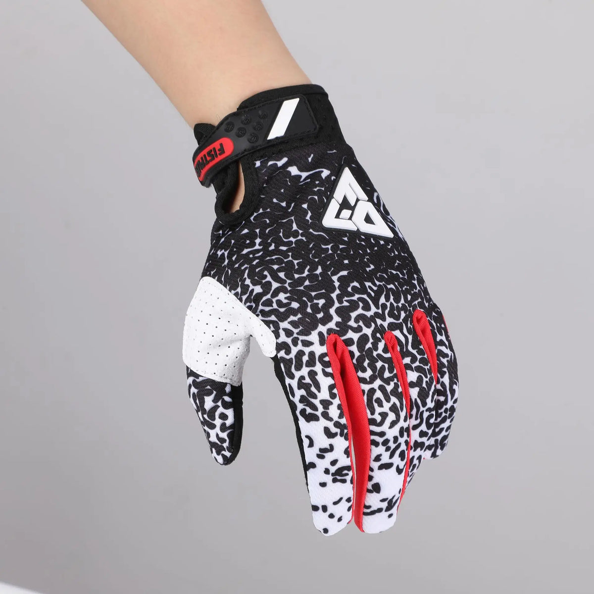 Black motocross gloves with leopard print palm and red accents