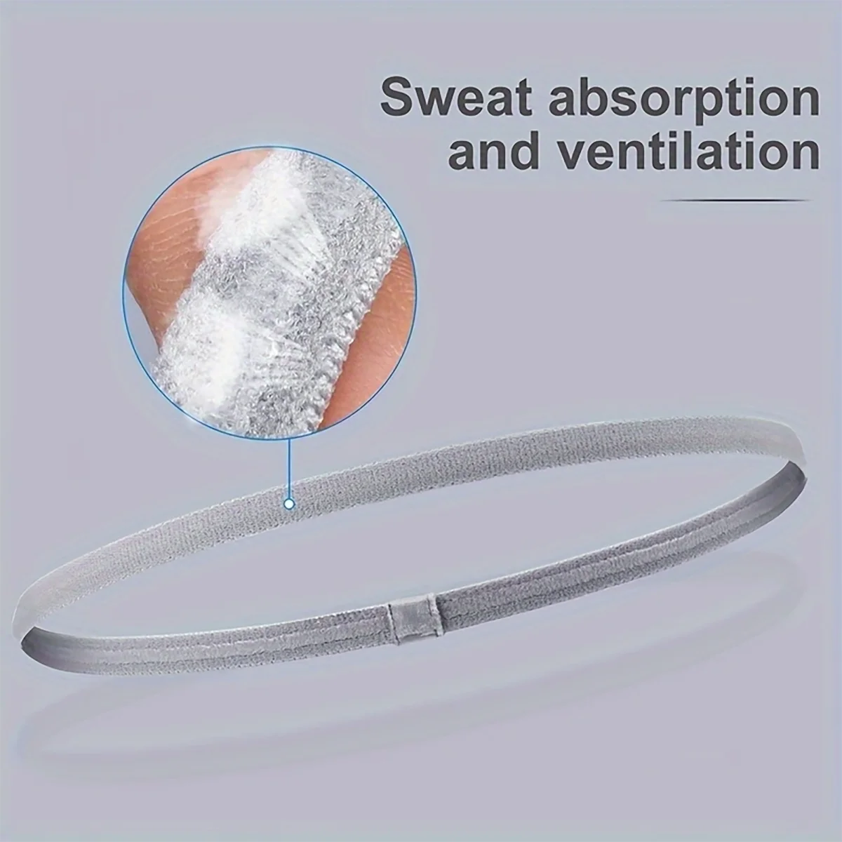 A gray hair tie is shown with a magnified view demonstrating sweat absorption and ventilation features.
