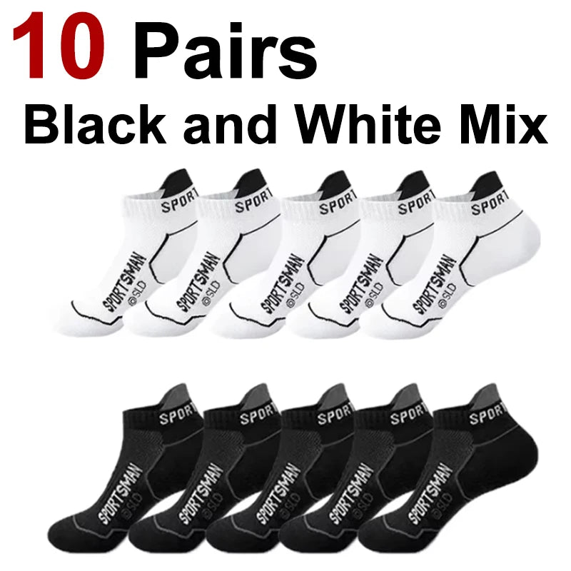 Ten pairs of black and white athletic socks are displayed, showing various styles and colors.