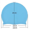 Light blue waterproof silicone swim cap showing dimensions of 19cm height and 19cm to 22cm width.