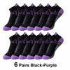 Six pairs of black-purple knit sports socks laid out for display.