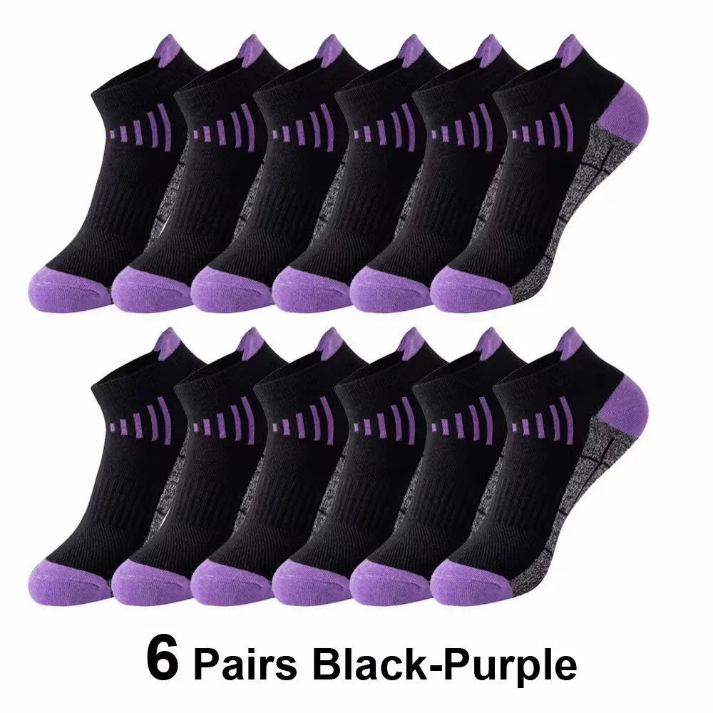 Six pairs of black-purple knit sports socks laid out for display.