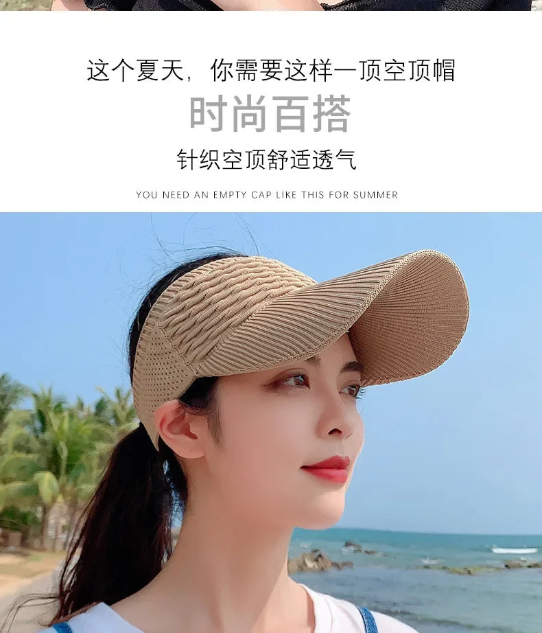 A woman wearing a beige breathable anti-UV adjustable sun hat outdoors near the sea.