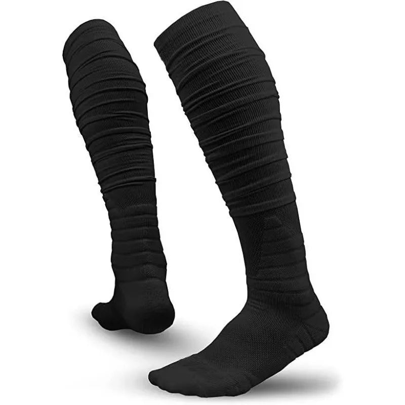 A pair of extra long black football socks for men shown standing vertically.