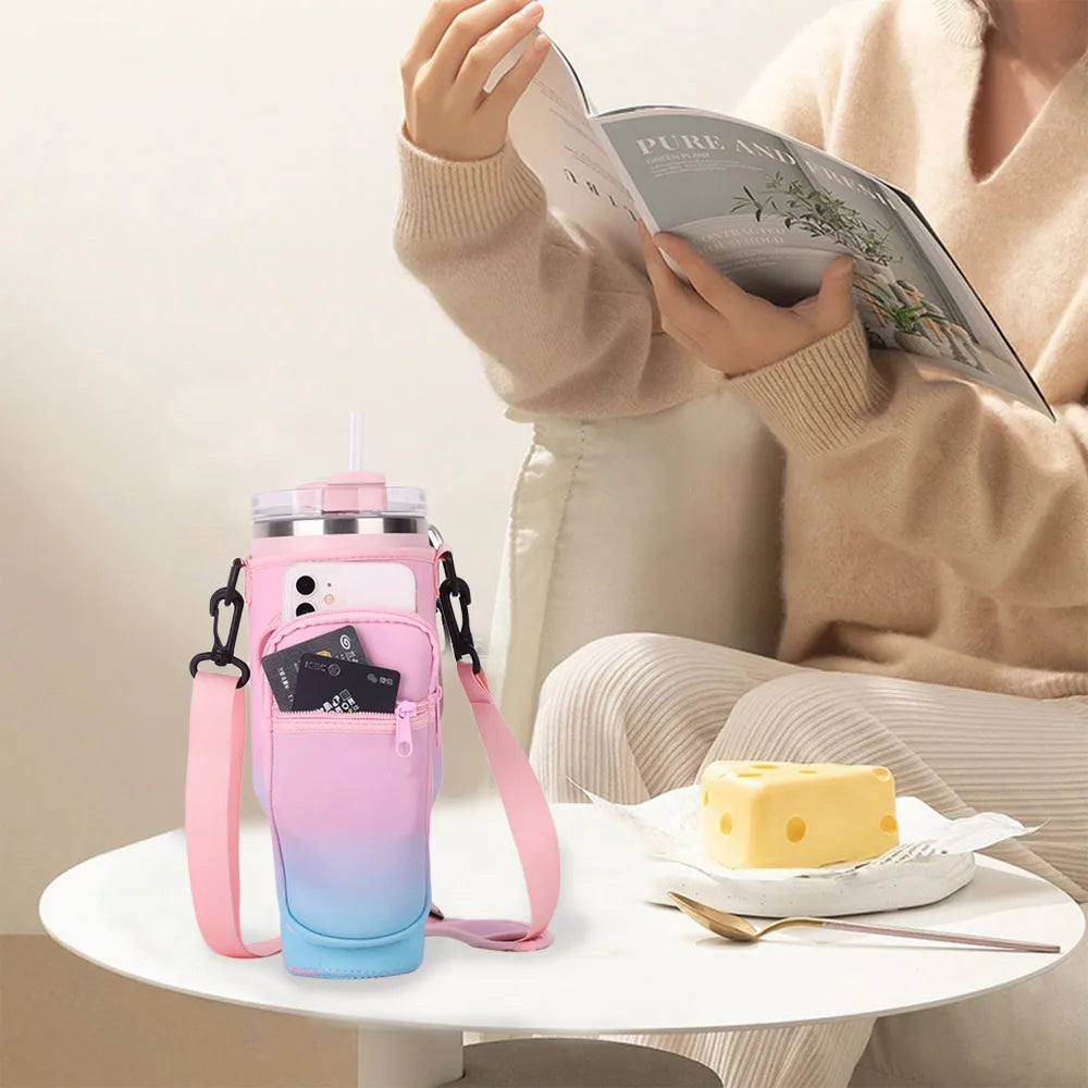 A pink and blue adjustable water bottle carrier pouch is shown next to a person reading a book.