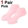 One pair of pink silicone moisturizing socks for cracked feet.