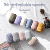 A collection of multi-colored headbandNA hair accessories in various shades of purple, pink, yellow, and green.