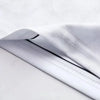A close-up of a white esports team jersey fabric showing a black trim detail.