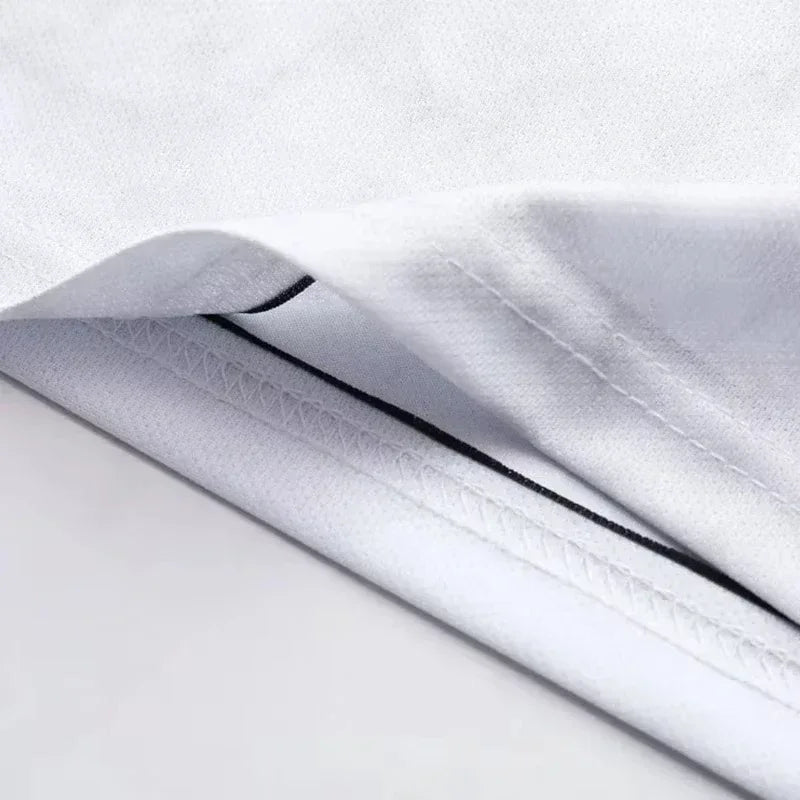 A close-up of a white esports team jersey fabric showing a black trim detail.