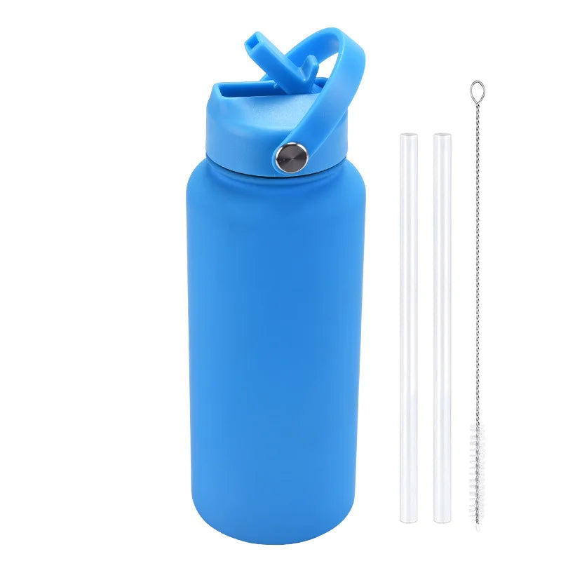 A bright blue stainless steel vacuum flask water bottle with a hinged straw lid and a separate metal straw.