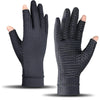 A pair of black copper arthritis relief gloves shown from the palm side.