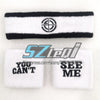 Black and white embroidered cotton sports wristbands featuring a circular logo design