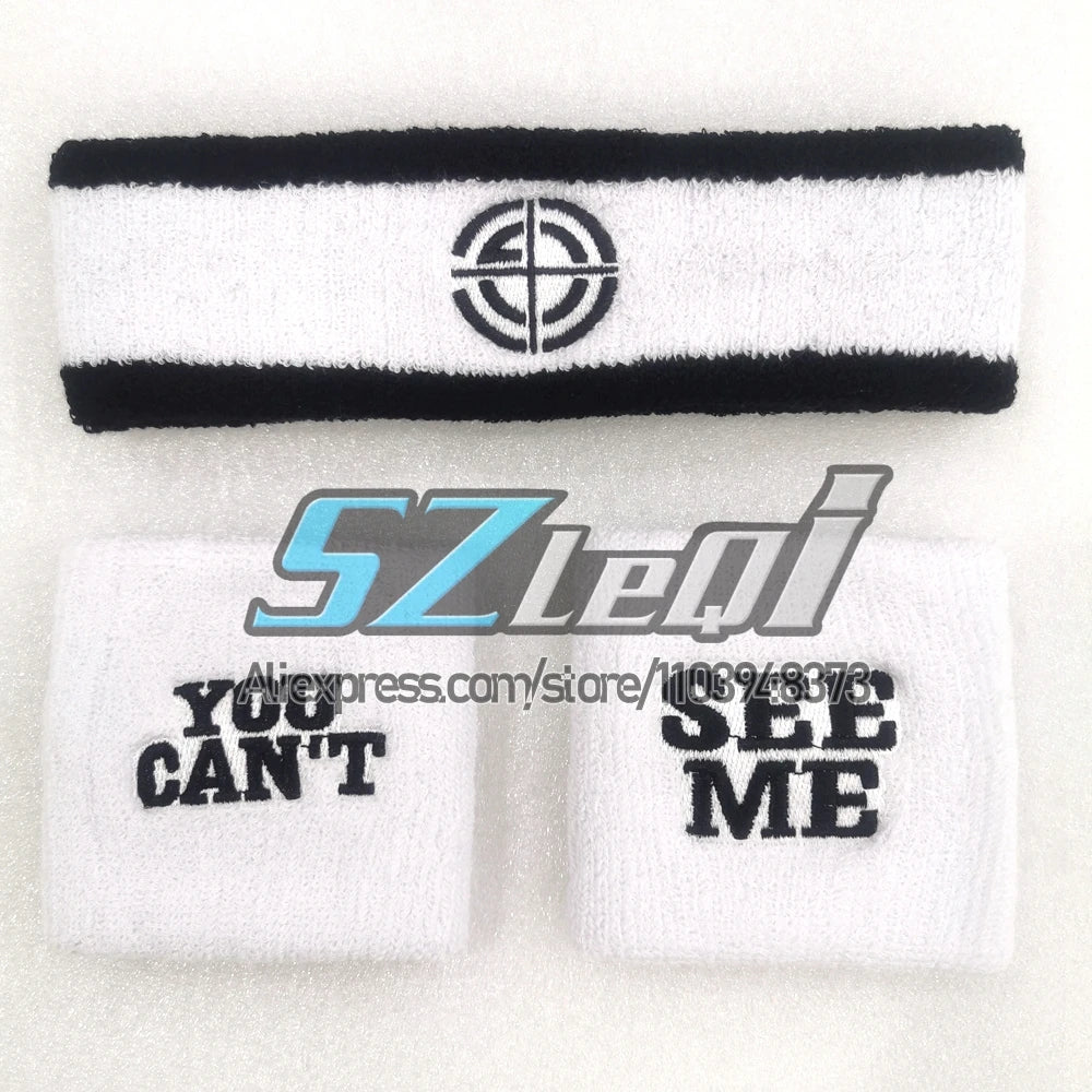 Set of black and white cotton sports wristbands with a circular logo design