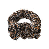 A black and brown leopard print heatless curling rod headband tied in a voluminous knot.