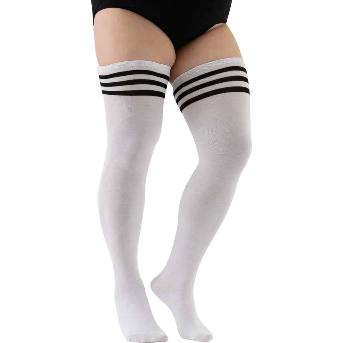 A pair of white striped thigh high leg warmers worn on a person's leg.