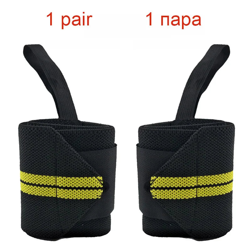 A pair of black heavy duty wrist wraps with yellow stripes shown from the side.