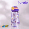 A purple silicone straw water bottle with a dinosaur unicorn design is shown on a white surface.