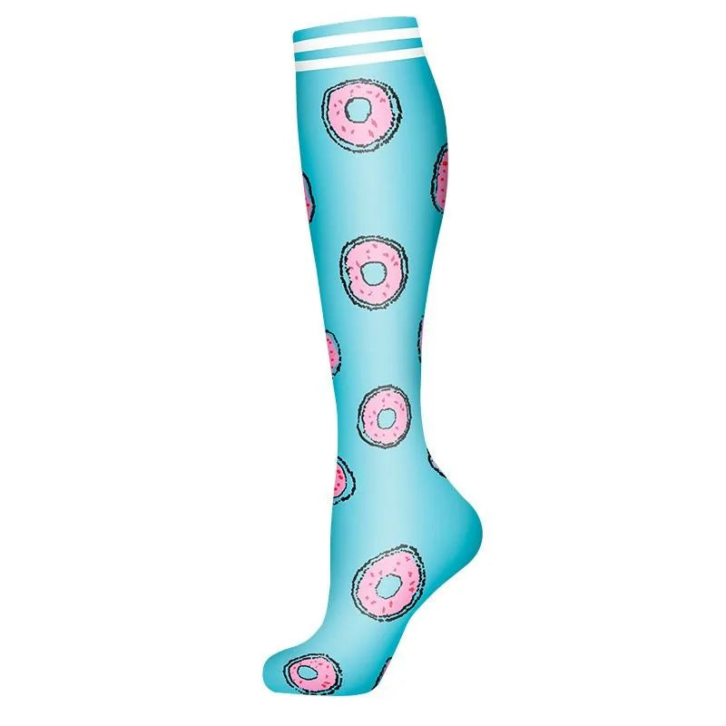 A pair of light blue compression socks with pink donut patterns.