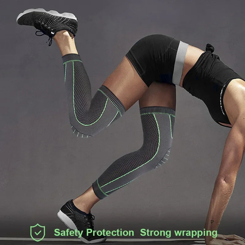 Person wearing black non-slip elastic knee sleeves and athletic shoes, demonstrating safety protection and strong wrapping.